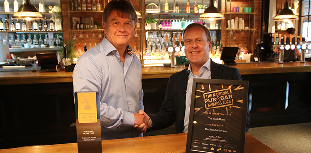 Pub owner receives award from tech company